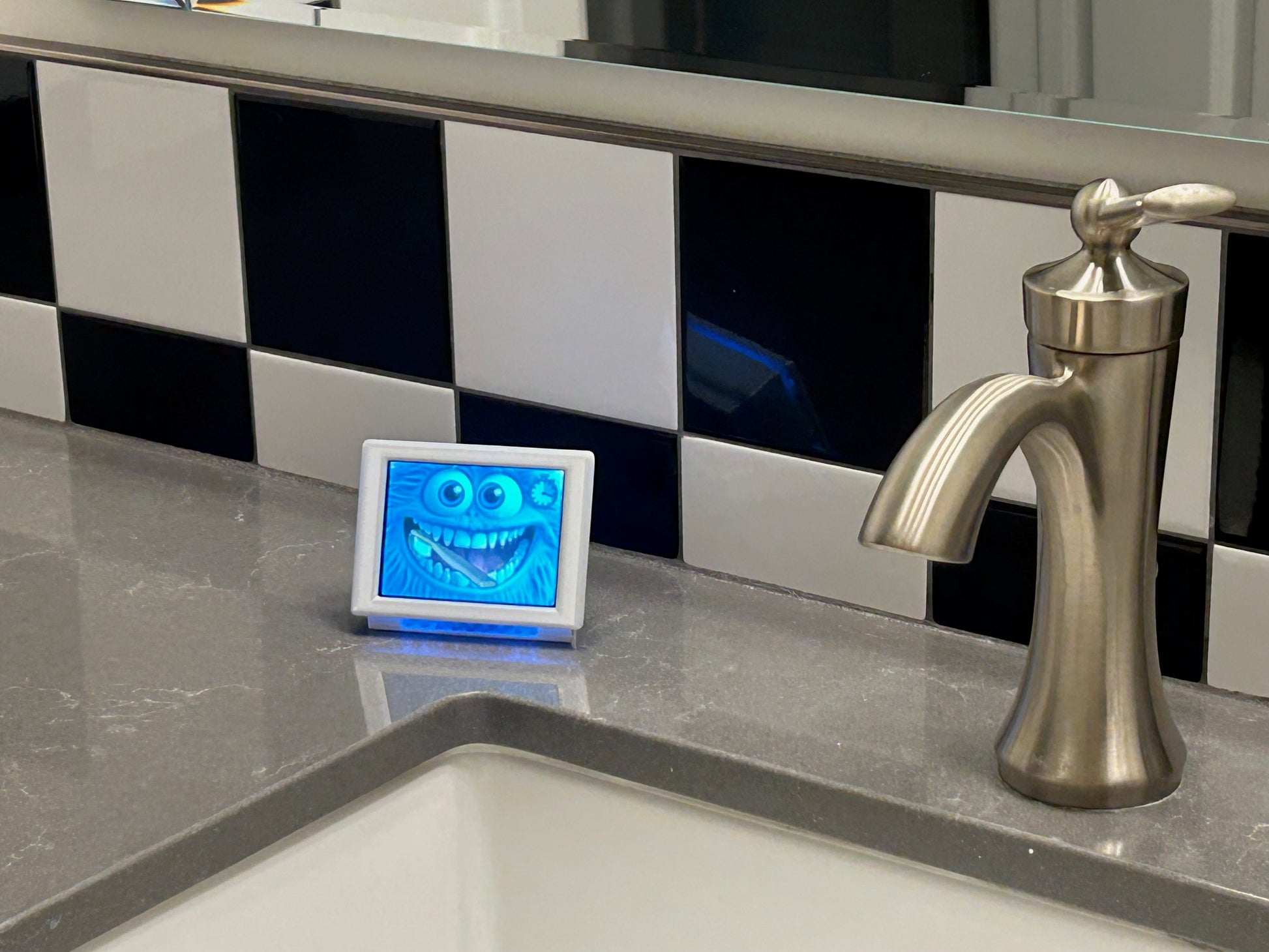 Bathroom sink With brushing device on a tiled wall.